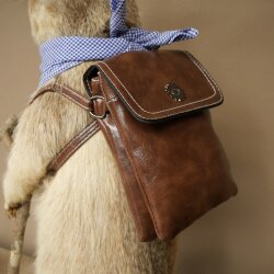 Taxidermied Wolpertinger marmot hiker with hat, backpack, neckerchief, walking stick, and pipe