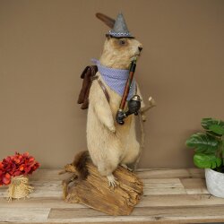 Taxidermied Wolpertinger marmot hiker with hat, backpack, neckerchief, walking stick, and pipe
